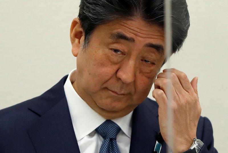 Analysis-Japan 'shadow shogun' Abe assured clout over next PM Kishida