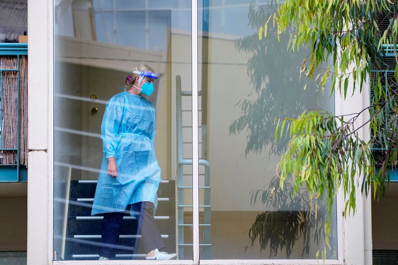 Australia hits vaccine milestone as Melbourne cases hover near record levels