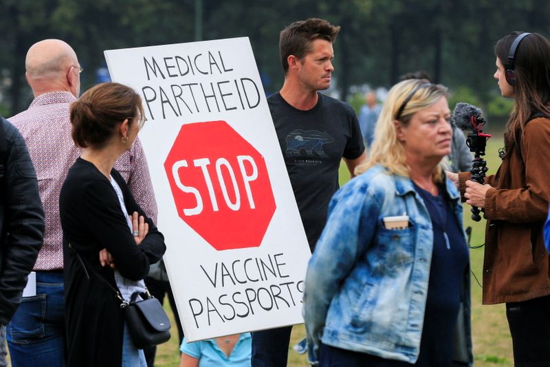 Dutch marchers protest new COVID-19 pass to enter bars, restaurants