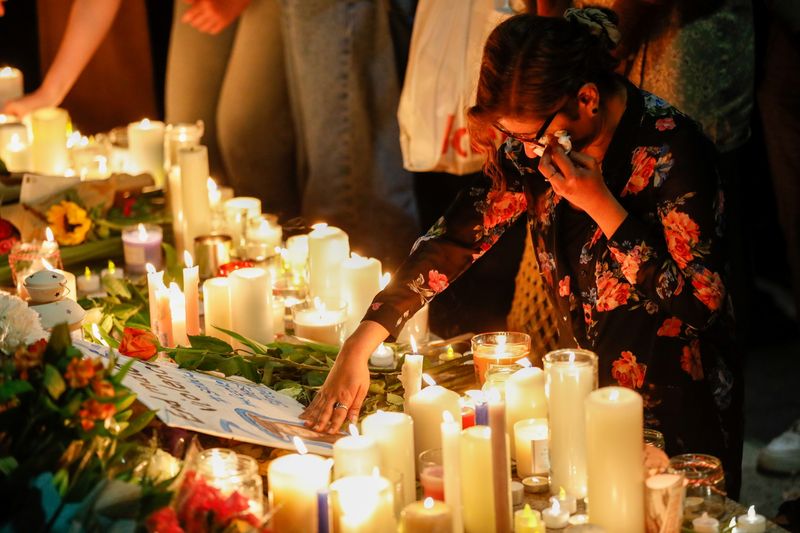 Vigils held for teacher murdered in London as suspect released