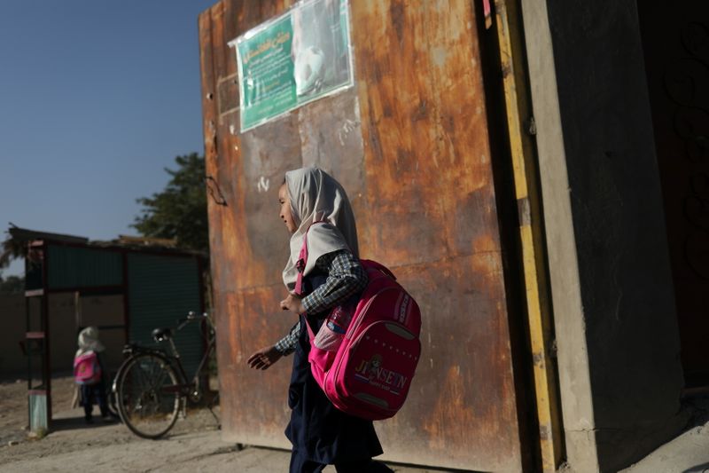 Afghan girls stuck at home, waiting for Taliban plan to re-open schools
