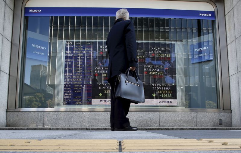 Asian shares, U.S. futures slip after earnings disappointment