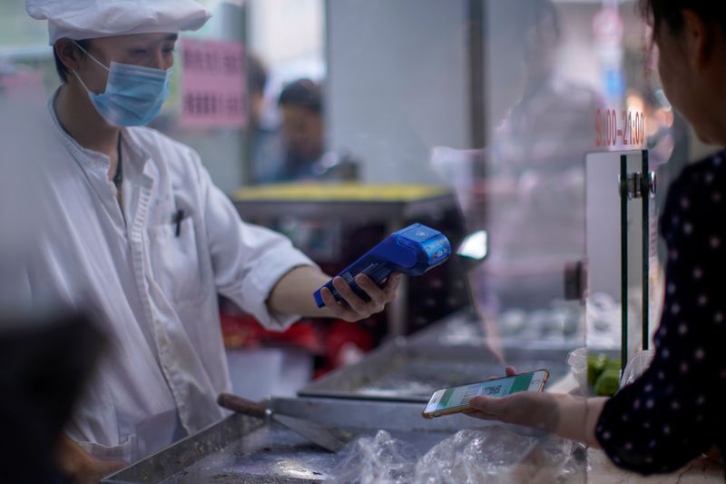 China October official services PMI falls to 52.4 vs 53.2 in September