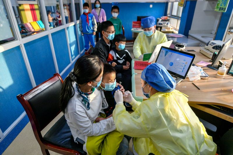 China's growing COVID-19 outbreak tests vulnerable border towns