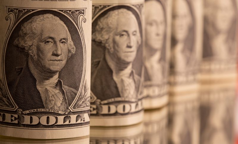 Dollar higher on upbeat U.S. data but set for weekly losses
