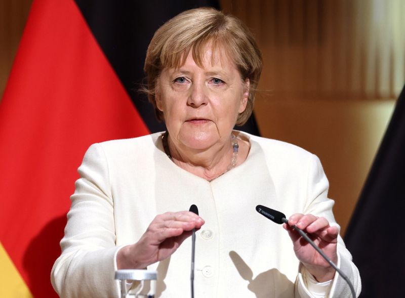 Emotional Merkel, marking German reunification, calls for tolerance