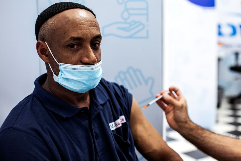 Israel requires COVID-19 booster shots for stricter 