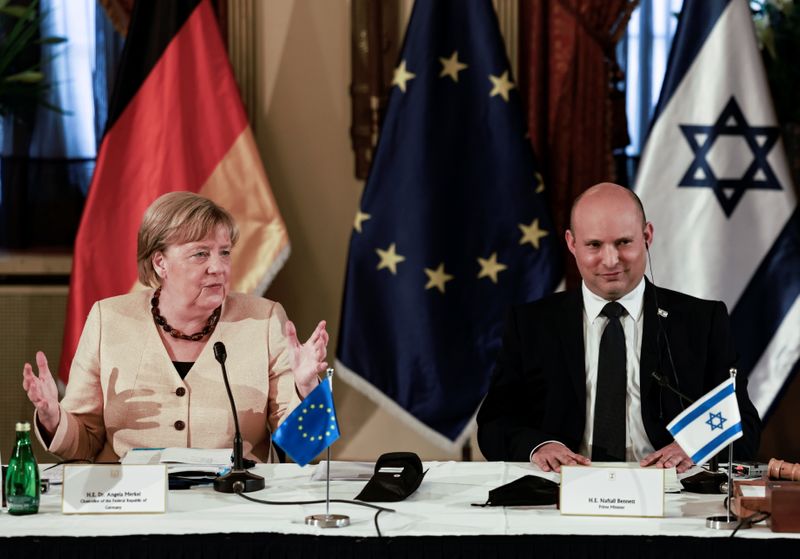 Merkel honours Holocaust victims, vows German commitment to Israel