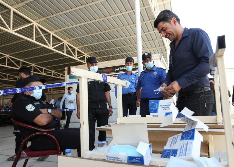 Soldiers, prisoners, displaced people vote early ahead of Iraq election