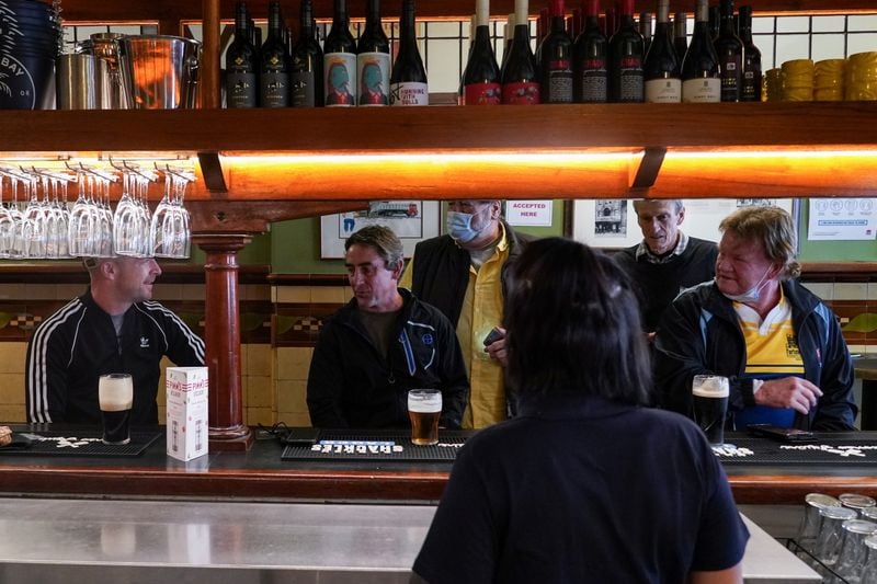 Sydney emerges from pandemic lockdown, beer in hand