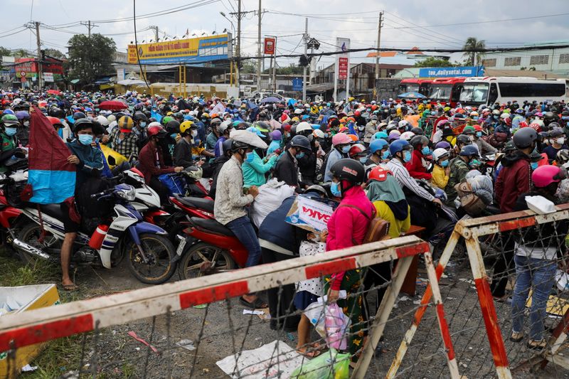 'We are tired': Workers flee Vietnam's largest city as long lockdown eases