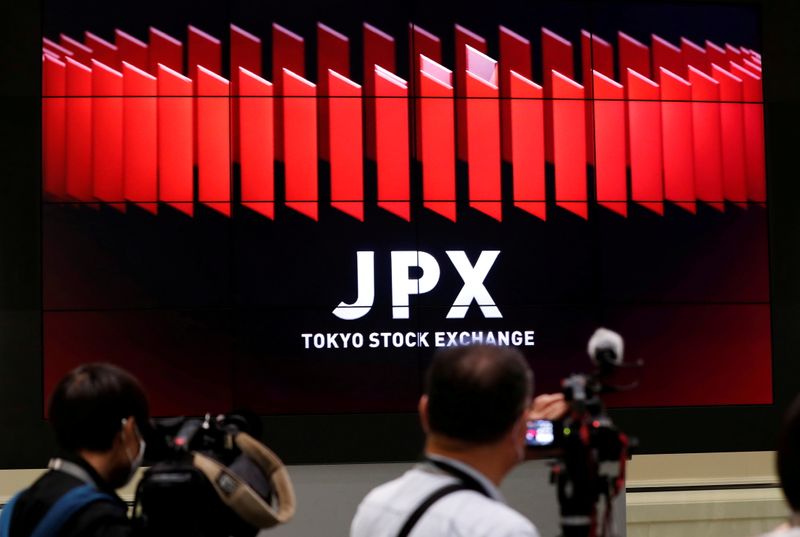 Asian stocks slump, dollar shines as inflation fears flare