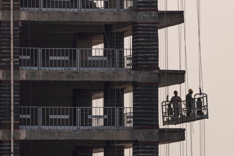 China's Modern Land says bond default triggers earlier repayment deadlines, pulls dividend