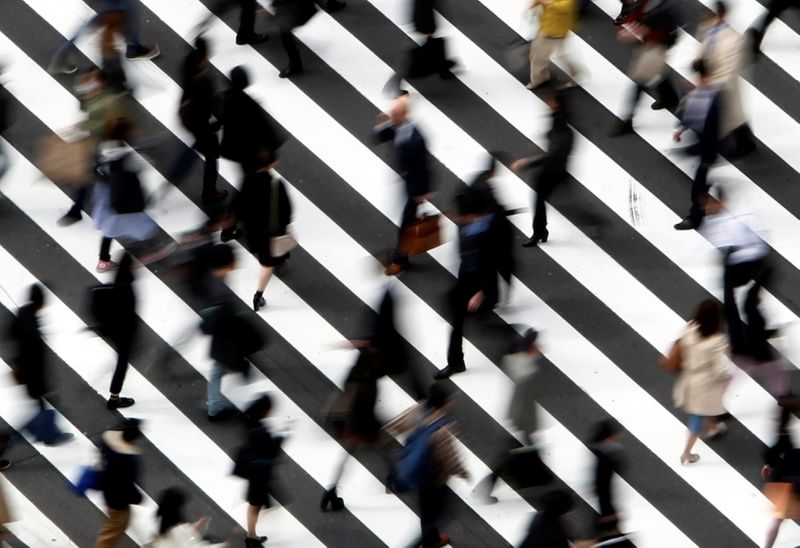 Japan's economy seen back in decline on COVID-19, supply issues - Reuters poll