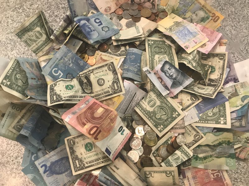 More trouble ahead for erratic emerging market currencies - Reuters poll