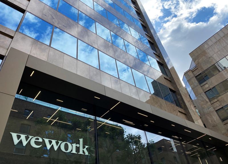 Office-sharing firm WeWork reports smaller quarterly loss