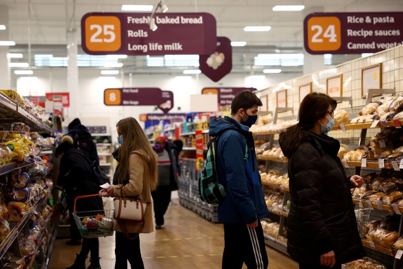 UK shoppers shrug off inflation worries to pick up their spending