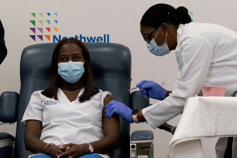 A year after first U.S. shots, pandemic hallmarks re-emerge