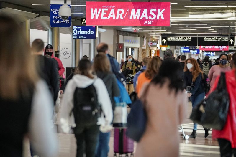 COVID-driven flight delays, cancellations persist on 2021's final day