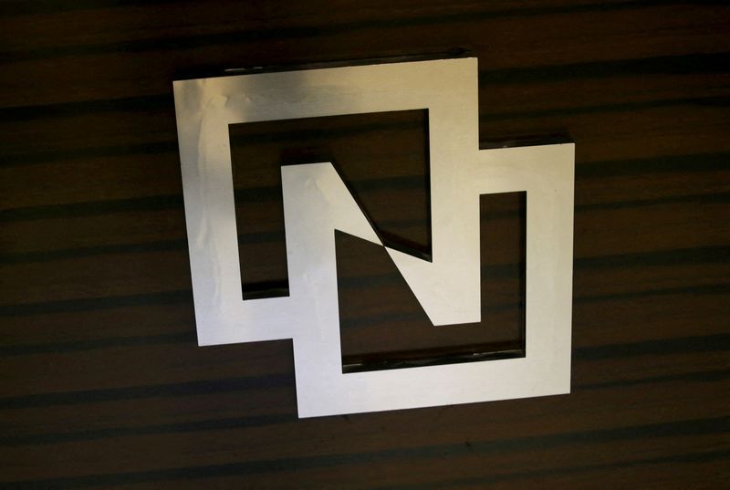 China's Tsinghua Unigroup dismisses chairman's criticism, defends restructuring plan