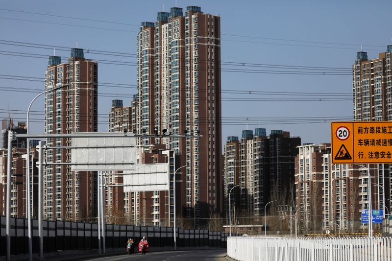 China's property woes worsen as home prices slip in November-survey
