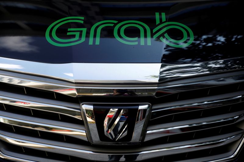 Factbox-Grab debuts on Nasdaq, marking biggest Southeast Asia listing