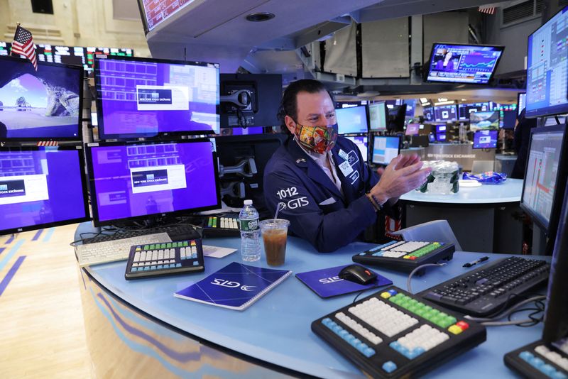 Futures resume year-end rally in thin trading; Tesla jumps
