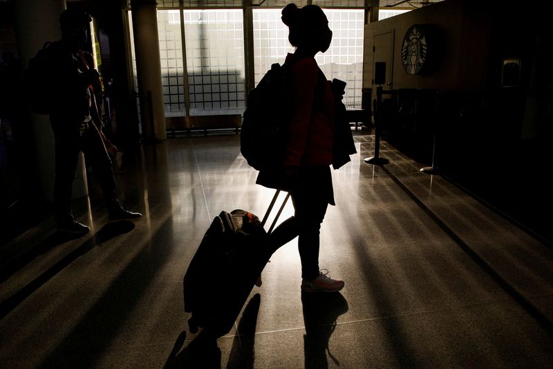 Holiday travel plans in flux as Americans weigh Omicron risk