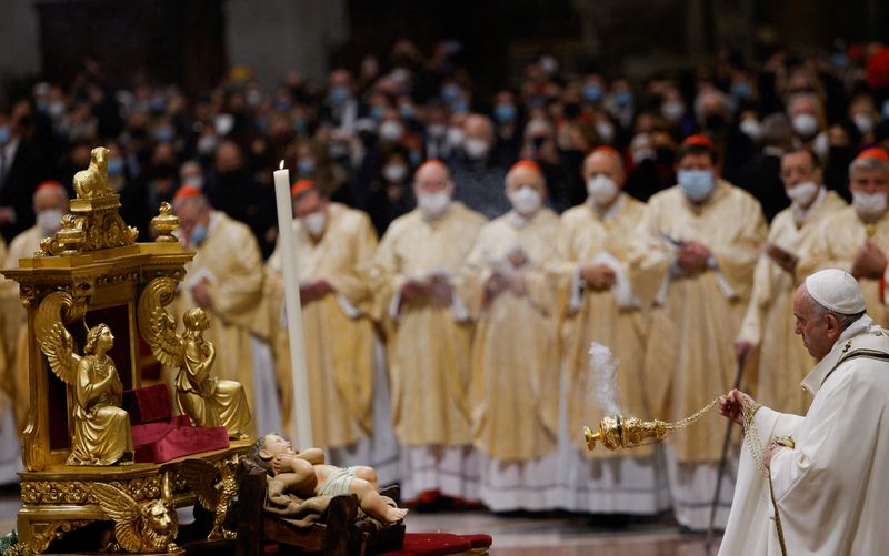 Look beyond the lights and remember the poor, pope says on Christmas eve