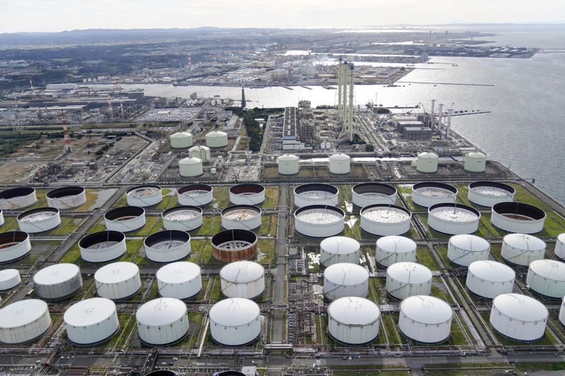 Oil edges higher as U.S. crude inventories decline