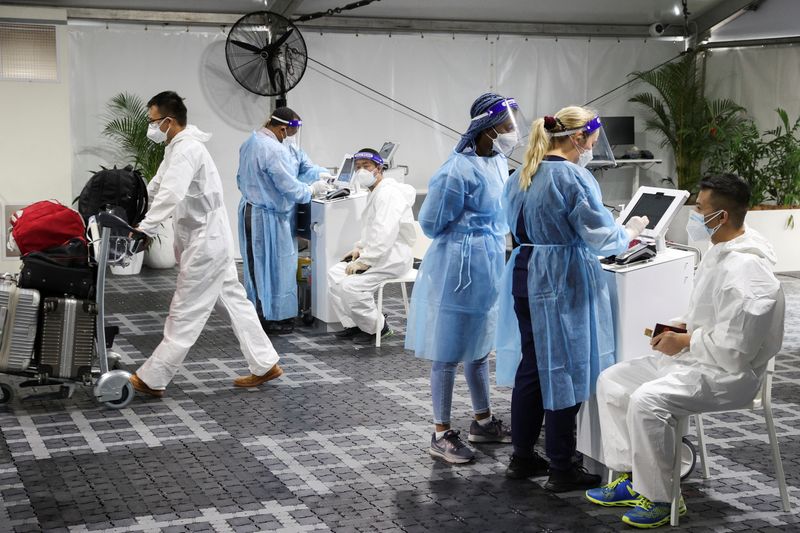 Omicron marches on as Biden prepares U.S. for grim winter