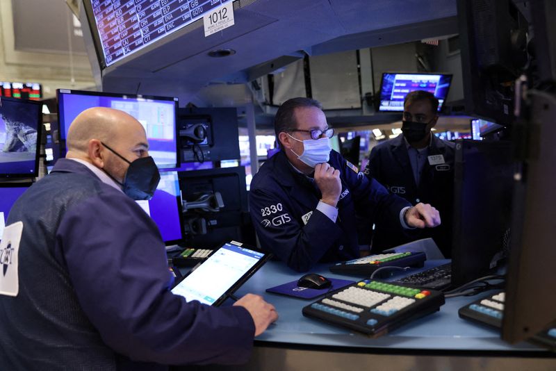 Wall St opens lower as Omicron worries persist