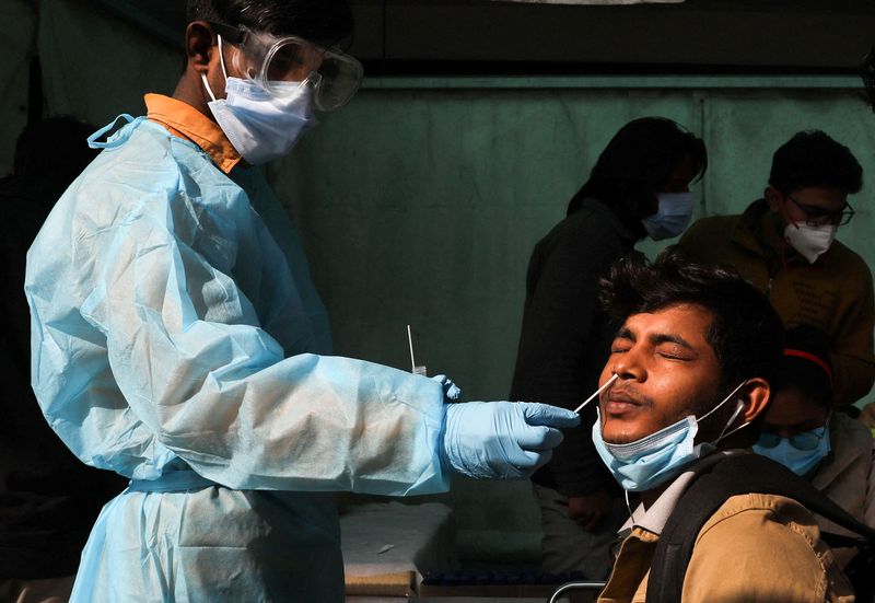Analysis-India's new COVID-19 rules aim to free up resources but carry risks