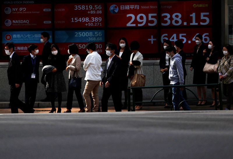 Asian shares fall after hawkish Fed minutes