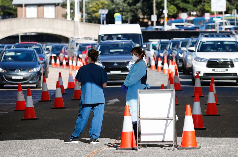 Australia COVID-19 cases surge, overloading testing system