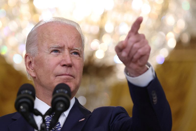 Biden, buoyed by GDP figures, urges Congress to pass bills