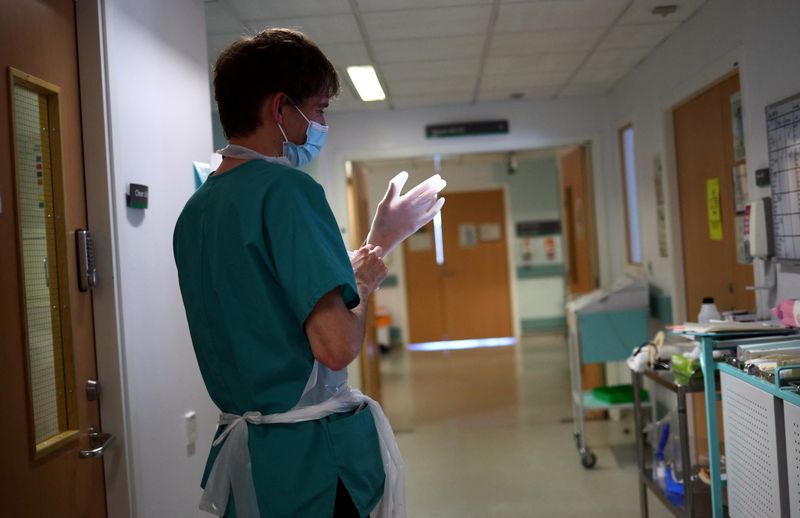 Britain calls in military to help with hospital COVID staffing crunch