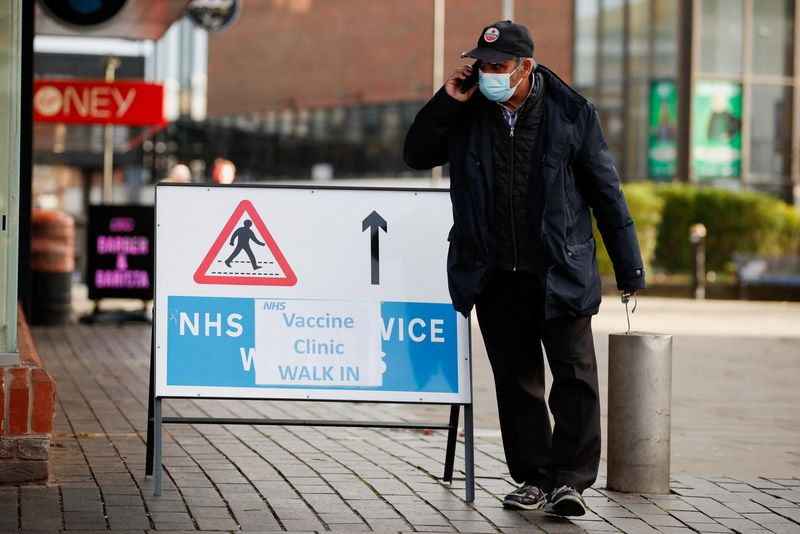 Britain reports record COVID-19 prevalence as Omicron surges