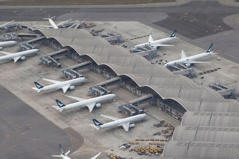 Cathay Pacific to further reduce passenger flights amid COVID restrictions