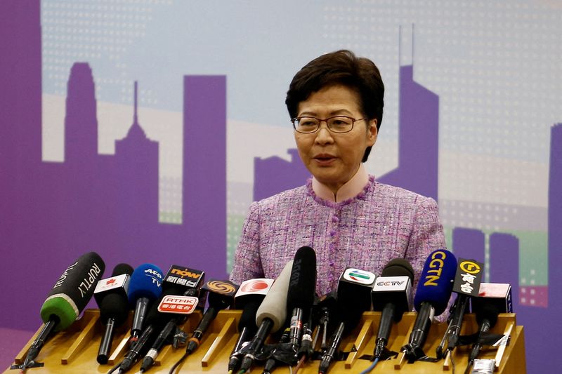Hong Kong leader orders probe of 13 officials who went to COVID-hit party