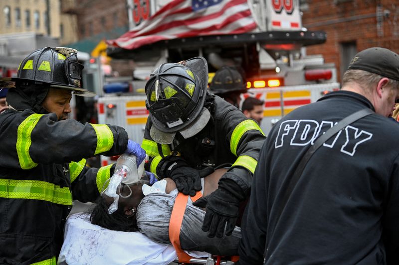 New York City apartment building fire kills 19, injures dozens -officials