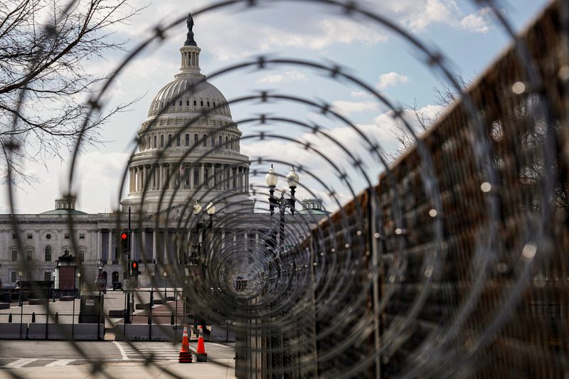 Riot shields and metal detectors are a reminder of deadly U.S. Capitol assault