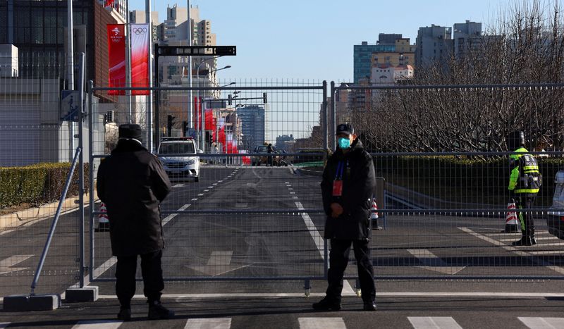 In Beijing's Olympic bubble: police escorts, daily COVID-19 tests, robot chefs