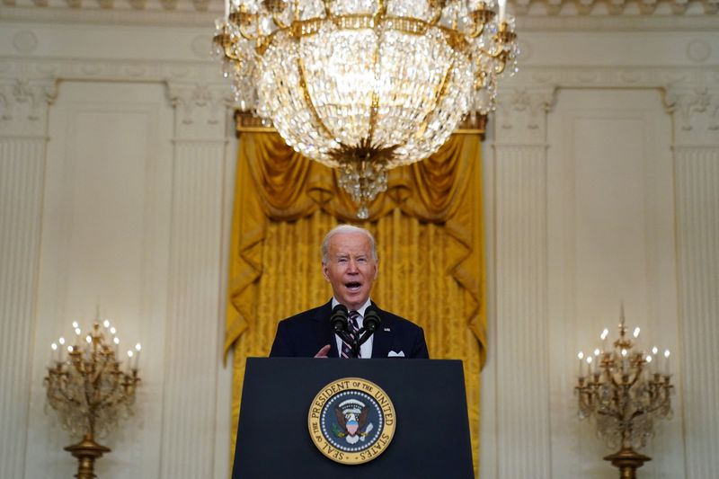 Biden announces first tranche of Russia sanctions, targets banks and debt
