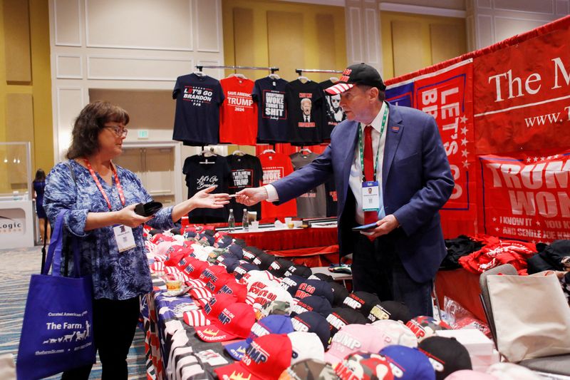 Hats, flags and deafening cheers: Conservative gathering consecrates Trump