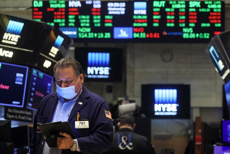 Futures edge lower ahead of data, earnings
