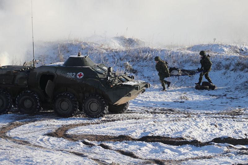Rouble leaps after Russia says some troops are returning to bases