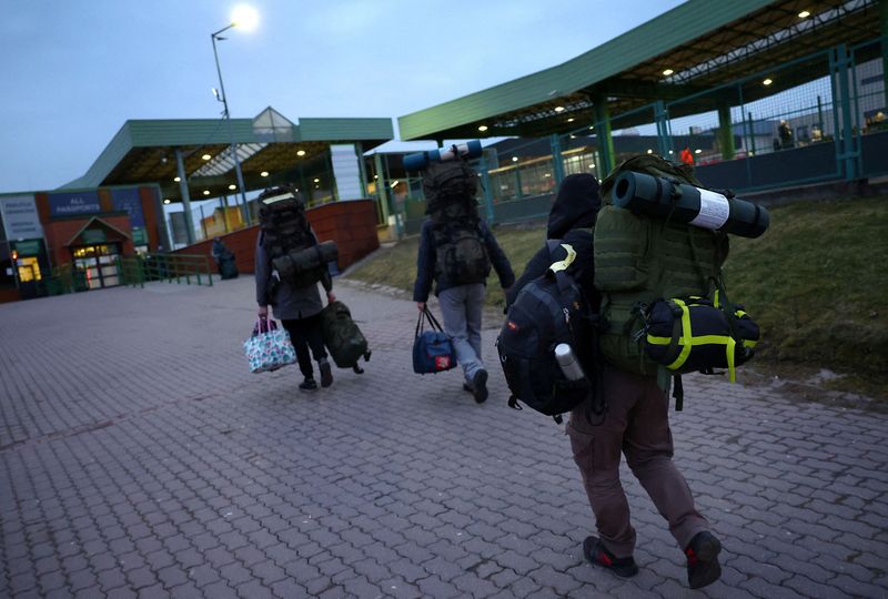 As Russia steps up assault, Ukrainians beat weary path to safety