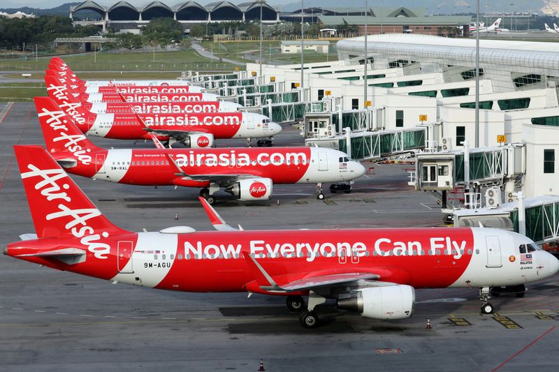 Factbox-Airline hedging and surcharges offset some oil price pain