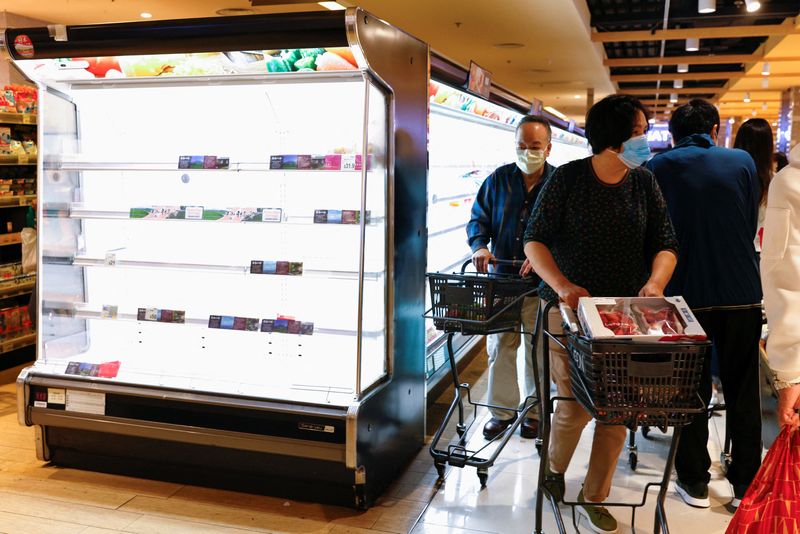 Hong Kong transport operators, supermarkets cut services as COVID cases surge